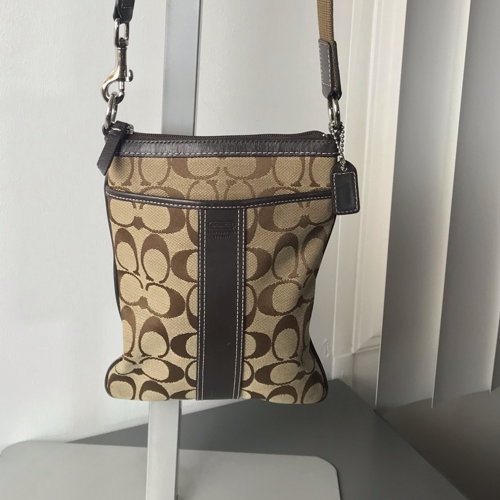 Signature Coach mini Crossbody.